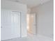 Neutral bedroom featuring a large closet with sliding doors and white trim at 2529 Mario Way, Clearwater, FL 33761