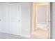 Bright bedroom featuring a large closet with sliding doors and white trim at 2529 Mario Way, Clearwater, FL 33761