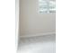Bedroom featuring soft carpet and a window with a view of trees at 2529 Mario Way, Clearwater, FL 33761