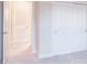 Bedroom showcasing bright sliding door closet and neutral color scheme and plush carpeting at 2529 Mario Way, Clearwater, FL 33761