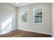 Bright bedroom with hardwood floor and two windows at 2529 Mario Way, Clearwater, FL 33761