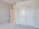 Inviting bedroom features a spacious closet and neutral carpeting offering a blank canvas for personal design at 2529 Mario Way, Clearwater, FL 33761