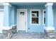 Welcoming front entrance with a view of the door and window showcasing the exterior view at 2529 Mario Way, Clearwater, FL 33761