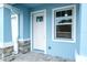 A charming entryway shows the front door, window, and stone column accents at 2529 Mario Way, Clearwater, FL 33761