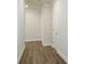 Hallway featuring wood flooring and white trim, offering a clean and modern look at 2529 Mario Way, Clearwater, FL 33761