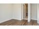 Hallway with hardwood floor leading to a bathroom at 2529 Mario Way, Clearwater, FL 33761
