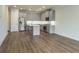 Bright kitchen features stainless steel appliances, island and hardwood floors at 2529 Mario Way, Clearwater, FL 33761