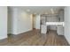 Bright kitchen features stainless steel appliances, island and hardwood floors at 2529 Mario Way, Clearwater, FL 33761