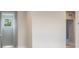 Well lit landing featuring a window and doorway at 2529 Mario Way, Clearwater, FL 33761