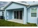 Enjoy the outdoors from this covered patio, complemented by a lush green lawn at 2529 Mario Way, Clearwater, FL 33761