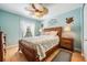 Relaxing bedroom features decorative artwork, ceiling fan and beautiful light at 2700 Bayshore Blvd # 542, Dunedin, FL 34698