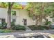 Charming condo with a well maintained landscape and elegant front door at 2700 Bayshore Blvd # 542, Dunedin, FL 34698