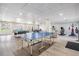 Spacious game room with ping pong table, pool table, and exercise equipment at 2700 Bayshore Blvd # 542, Dunedin, FL 34698