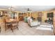 Open living space showcasing the kitchen, dining and living areas, with tile flooring at 2700 Bayshore Blvd # 542, Dunedin, FL 34698