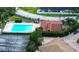 An aerial view showcasing the inviting pool area and tennis court at 2971 Estancia Blvd # 328, Clearwater, FL 33761