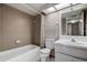 Cozy bathroom featuring a bathtub, shower, and a single sink vanity with a mirror at 2971 Estancia Blvd # 328, Clearwater, FL 33761