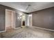 Neutral toned bedroom offers versatility, a walk-in closet, and a ceiling fan at 2971 Estancia Blvd # 328, Clearwater, FL 33761