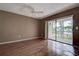 Relaxing bedroom boasts sliding glass door access to the outdoor area and a ceiling fan at 2971 Estancia Blvd # 328, Clearwater, FL 33761