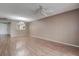 Spacious living room features hardwood floors and a ceiling fan for added comfort at 2971 Estancia Blvd # 328, Clearwater, FL 33761