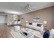 Inviting living room and dining area with a ceiling fan and modern furnishings that create a stylish, comfortable space at 2971 Estancia Blvd # 328, Clearwater, FL 33761