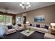 Stylish living room boasts ample seating and bright natural light from an outdoor patio at 2971 Estancia Blvd # 328, Clearwater, FL 33761