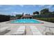 Relaxing community pool area with lounge chairs and ample space for sunbathing and recreation at 2971 Estancia Blvd # 328, Clearwater, FL 33761