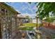 Picturesque backyard with mature trees, landscaping, koi pond, and charming swing at 3042 57Th N Ave, St Petersburg, FL 33714