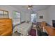 Comfortable bedroom includes a ceiling fan, ample natural light, and neutral paint at 3042 57Th N Ave, St Petersburg, FL 33714