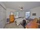Comfortable bedroom includes a ceiling fan, ample natural light, and neutral paint at 3042 57Th N Ave, St Petersburg, FL 33714