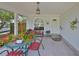 Cozy covered front porch featuring comfortable seating arrangements, perfect for enjoying the outdoors in a relaxed setting at 3042 57Th N Ave, St Petersburg, FL 33714