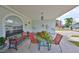 Inviting front porch with seating, perfect for relaxing and enjoying the neighborhood views, showcasing home's cozy appeal at 3042 57Th N Ave, St Petersburg, FL 33714