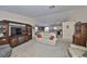 View of the living room with an open floor plan leading into the dining and kitchen areas at 3042 57Th N Ave, St Petersburg, FL 33714