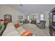 Spacious living room with a fireplace, comfortable seating, and plenty of natural light, perfect for relaxation and entertainment at 3042 57Th N Ave, St Petersburg, FL 33714