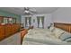 Well-lit bedroom with plush carpet, wood furniture, a ceiling fan, and two windows at 3042 57Th N Ave, St Petersburg, FL 33714