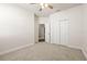 This unfurnished bedroom features soft carpet, closet with doors, and neutral paint at 3204 Mapleridge Dr, Lutz, FL 33558