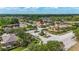 The neighborhood entrance boasts a water feature and meticulously manicured landscaping at 3204 Mapleridge Dr, Lutz, FL 33558