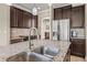 Close up on the kitchen island showcasing a stainless steel sink and granite countertops at 3204 Mapleridge Dr, Lutz, FL 33558
