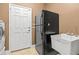 Spacious laundry room includes appliances, sink, and a utility door at 3204 Mapleridge Dr, Lutz, FL 33558