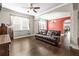Comfortable living room with hardwood floors, neutral walls, and lots of natural light at 3204 Mapleridge Dr, Lutz, FL 33558