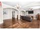 Open-concept living area with hardwood floors, stylish decor, and neutral paint at 3204 Mapleridge Dr, Lutz, FL 33558
