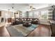 Open concept living room with an eat in kitchen and a view to the back of the house at 3204 Mapleridge Dr, Lutz, FL 33558