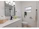 Well-lit bathroom with stylish vanity, modern fixtures, and a tiled shower visible in the mirror at 3230 Queensboro S Ave, St Petersburg, FL 33712