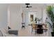 Cozy dining area with a round table, stylish seating, and an open view of the living space at 3230 Queensboro S Ave, St Petersburg, FL 33712