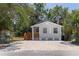 Attractive single-story home with a lovely covered porch and well-maintained landscaping at 3230 Queensboro S Ave, St Petersburg, FL 33712