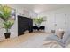 Stylish living room with a black brick fireplace, neutral walls, and contemporary furniture arrangement at 3230 Queensboro S Ave, St Petersburg, FL 33712
