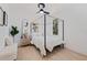 Bright main bedroom features a four-poster bed frame and natural light from the large windows at 3230 Queensboro S Ave, St Petersburg, FL 33712