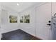 Mud room with black tiled flooring and access to backyard and utility closet at 3230 Queensboro S Ave, St Petersburg, FL 33712