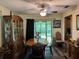 Traditional dining room featuring a wood table set, cabinet, and sliding doors to the backyard at 3405 Holland Dr, Brandon, FL 33511