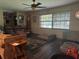 Cozy living room featuring hardwood floors, multiple sofas and large windows for natural light at 3405 Holland Dr, Brandon, FL 33511