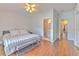 Comfortable bedroom featuring en-suite bathroom and hardwood floors at 3456 High Hampton Cir, Tampa, FL 33610